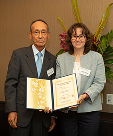 “Presentation of Grants” Mr. Mitsuo Igarashi, Chairman (Left) Dr. Ayfer Ozgur, Stanford University (Right)